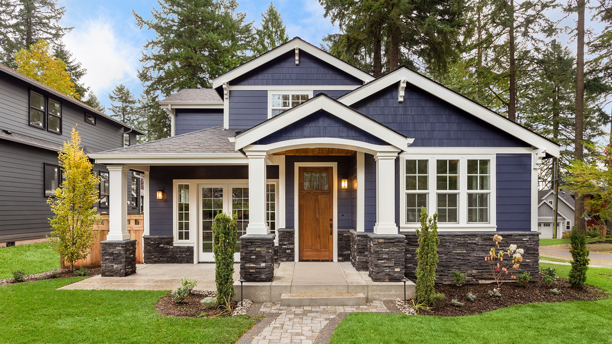 Beautiful Luxury Home Exterior with Green Grass and Landscaped yard